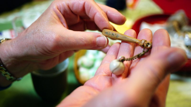 My mother had carved a baseball bat and made this little trinket...you can see Kenichiro’s writing on it...