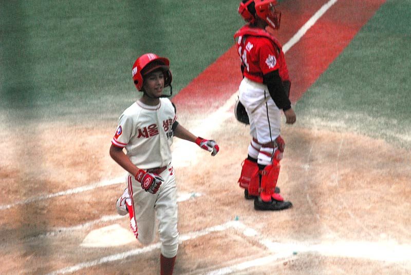 The coach waives him on to third, then on and on until he crosses home plate! An in the park home run!!! The crowd went wild!