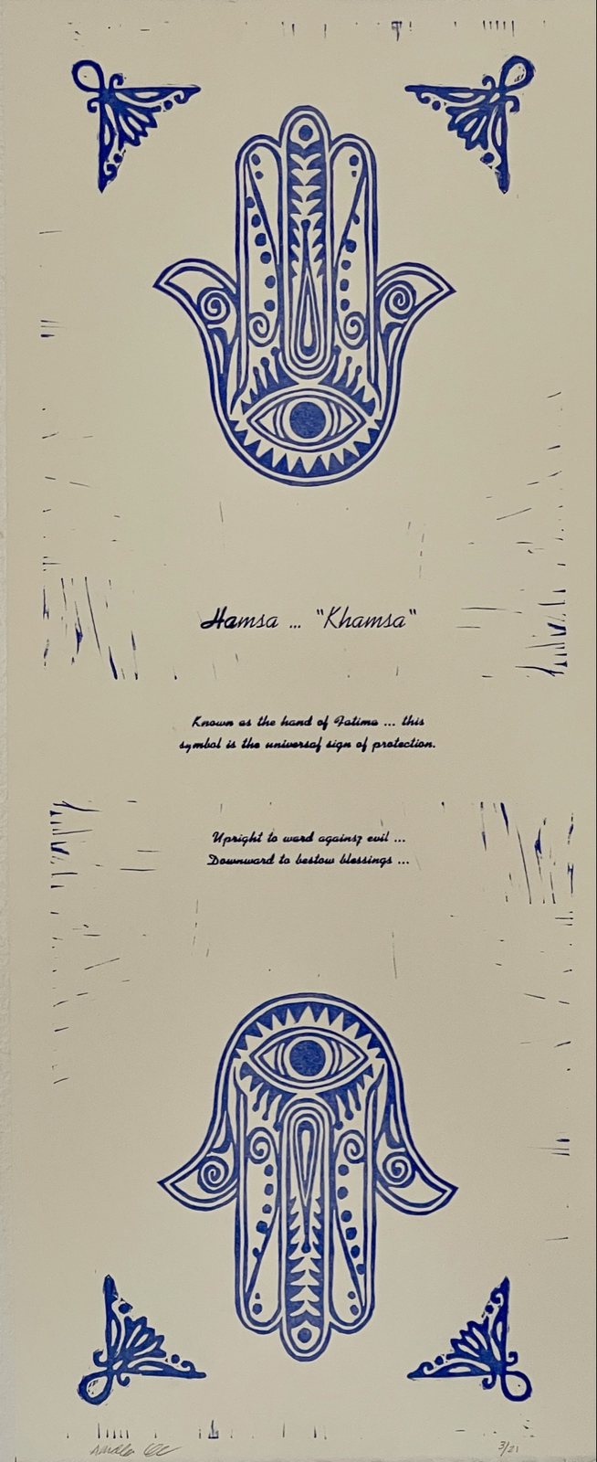 Blue block print of the Hamsa, the hand of Fatima, with hand-lettered text.