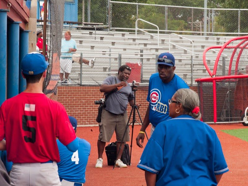 Coach Ernest Radcliffe and others on the field.