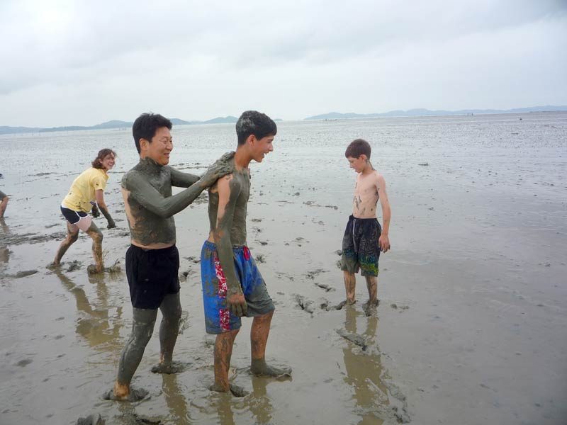 “Oh, Austin, let me put a little sunblock on your back...” “But Mr. Lee, I forgot the sunblock...” “Austin, we are in Korea! This is how we roll at the beach!”