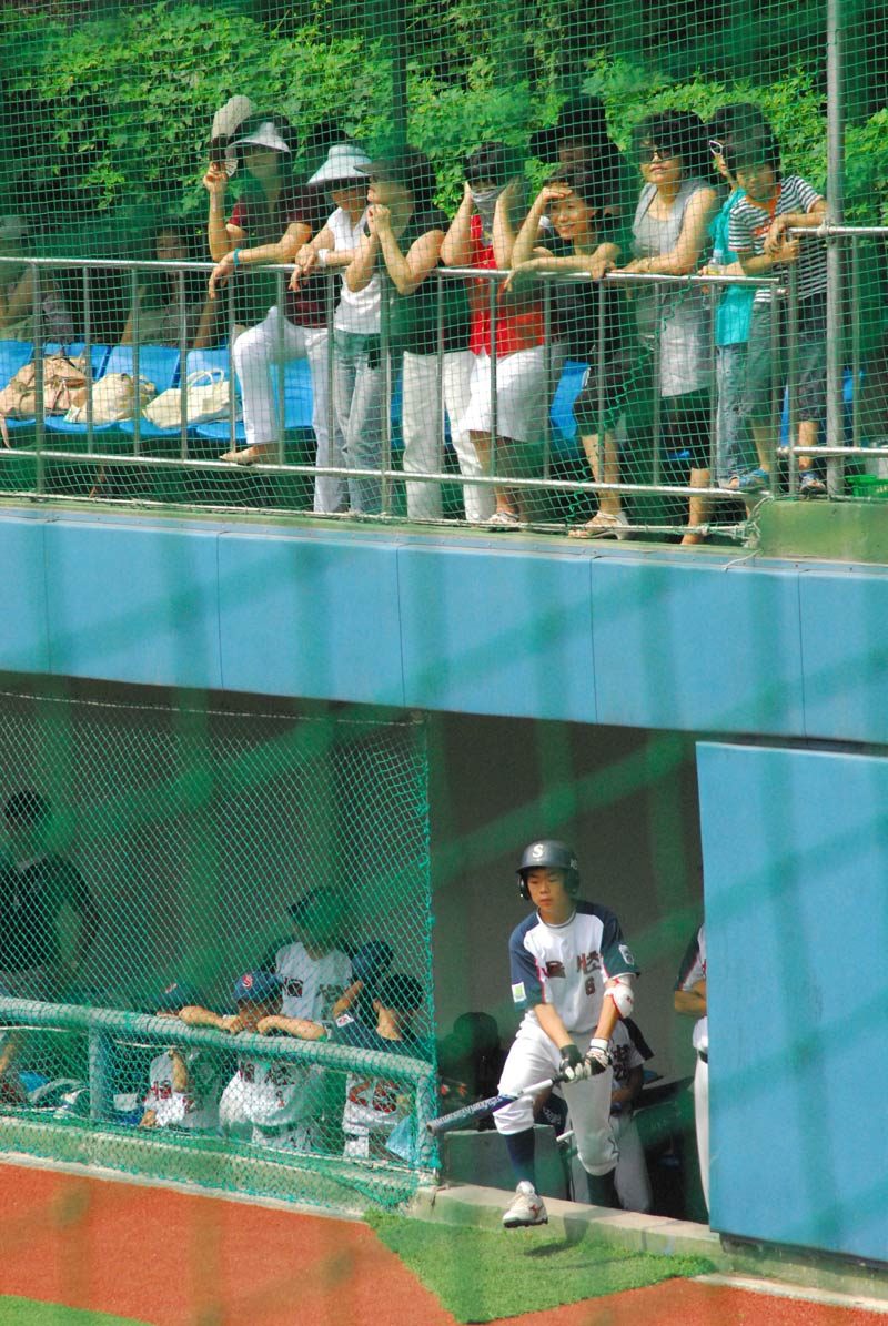 You heard of soccer moms? Well, above, watching every move on the field, are baseball ajuma (moms). I have grown to love them, but don’t make them mad... ;-)