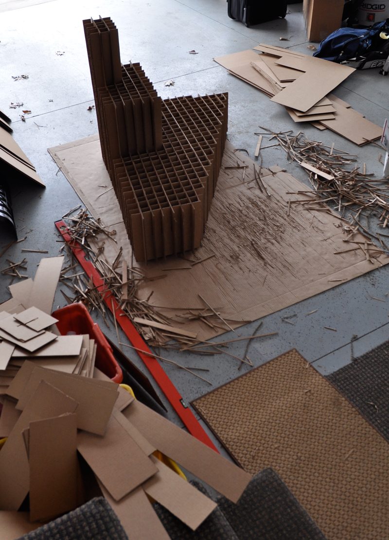 Amanda was required to put together an exhibition for her senior thesis. She decided to create a functional piece of art that served has a stand and drew attention to other pieces.