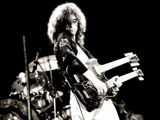 Jimmy Page of Led Zeppelin with Gibson’s double necked SG (EDS-1275), “the coolest guitar in rock”...do you know Stairway to Heaven? ...Jimmy used this to play live without the cumbersome switching of guitars midway through Led Zeppelin’s signature song...that’s innovation!