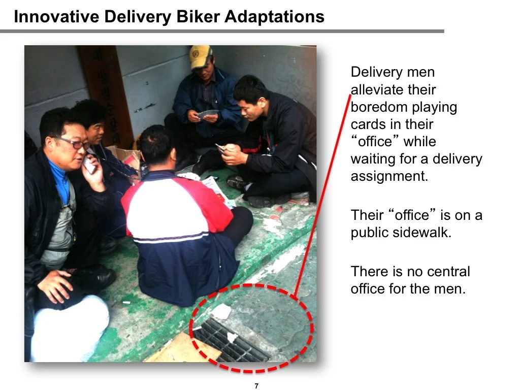 Observation of delivery bikers: mobile shipping offices with air-conditioning units set up on public sidewalks, and packages being aggregated from smaller to larger trucks on the street.